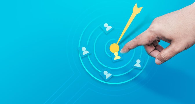 Business target audience selection concept, hand pointing customer icon on digital radar interface for niche marketing strategy, customer segmentation, lead targeting and data driven audience analysis
