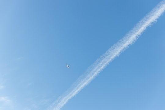 airplane trail in the blue sky