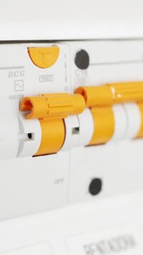 Close-up of man turning on the fusebox