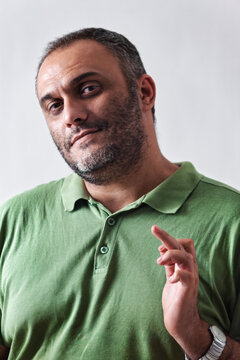 Sarcastic Middle Eastern arab Man Making Defiant Hand Gesture, studio portrait