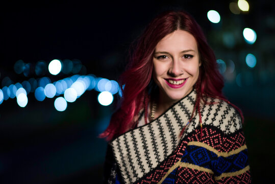 Women in the city, night bokeh portrait