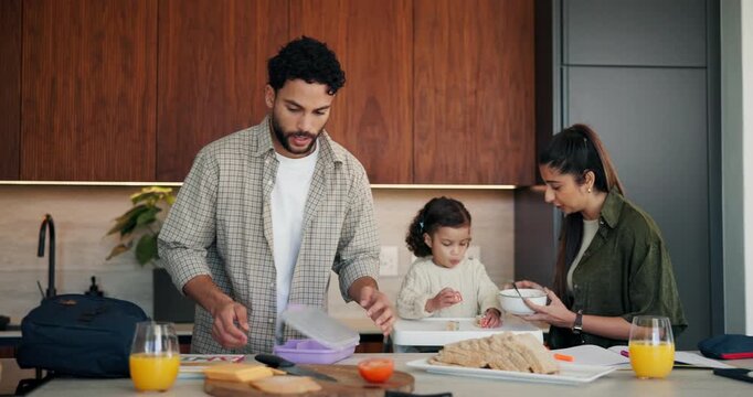 Family, kid and packing lunch in home for morning routine, support and feeding in kitchen. Breakfast, eating or mom and dad with toddler for helping with cereal, getting ready and busy with bag