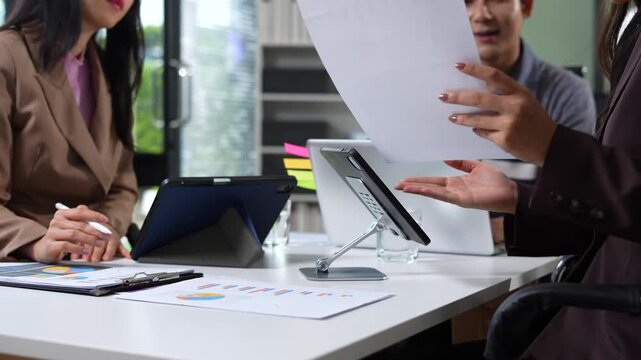 Businessman collaborate on project analysis with financial graphs. Strategic teamwork and insights drive company growth and success.