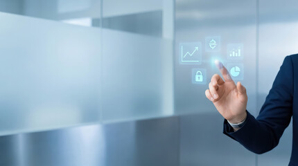Fototapeta premium Businessman in a suit interacting with a digital interface showing glowing blue for data analytics, security, and growth in an office setting