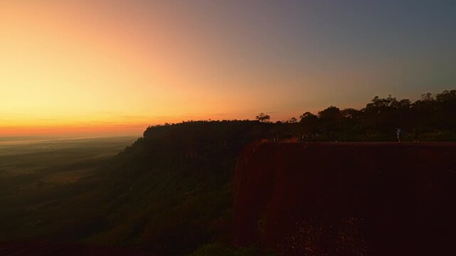 Bueng Kan, Thailand. 02 December 2025; Three Whale Rock Iconic Viewpoint of Northeastern Thailand. Epic sunrise at a famous Thai viewpoint, capturing tiny human figures on a colossal rock ledge