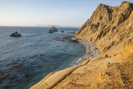 Paracas, Peru - 3 Dec 2025: Sunset on the Pacific coast in the deserts of the Paracas National Reserve, Peru
