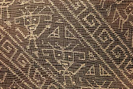 Paracas, Peru - 2 Dec 2025: Textiles from the Nasca and Wari cultures on display at the Hacienda Bahia Paracas Museum