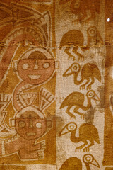 Fototapeta premium Paracas, Peru - 2 Dec 2025: Textiles from the Nasca and Wari cultures on display at the Hacienda Bahia Paracas Museum