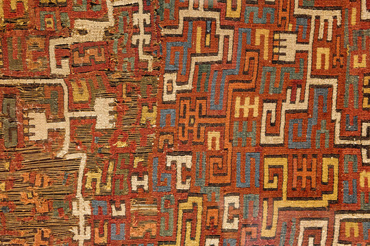 Paracas, Peru - 2 Dec 2025: Textiles from the Nasca and Wari cultures on display at the Hacienda Bahia Paracas Museum