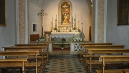 Fototapeta premium Chapel interior softly defocused with bokeh, altar and wooden pews receding into warm blur, church background; background backplate copyspace calm.
