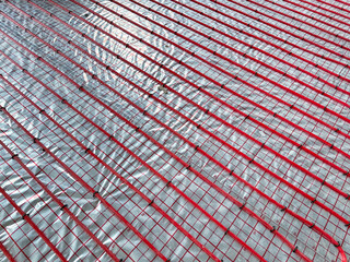 Fototapeta premium Installation of underfloor heating system in building, above view