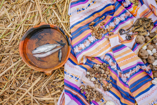 Puno, Peru - 29 Nov, 2025:  Fresh fish and corn dry in the sun on the Uros Islands, Lake Titicaca, Peru
