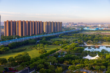 Wuxi city park greenery and residential high-rise environment, China © 肖勇