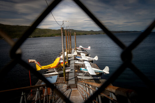 Seaplanes Docked on a Quiet Seaside Pier