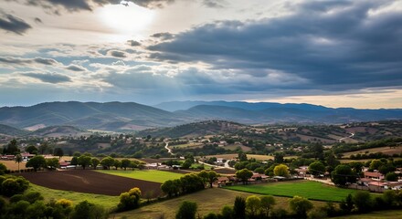 Fototapeta premium Rural landscape with green fields mountains.