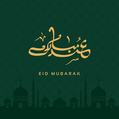 Golden arabic calligraphy eid mubarak with mosque silhouette on green pattern background © Jannat