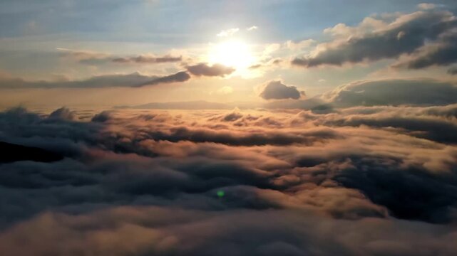 Cinematic sunset over a dramatic sea of clouds captured in stunning 4K aerial video.