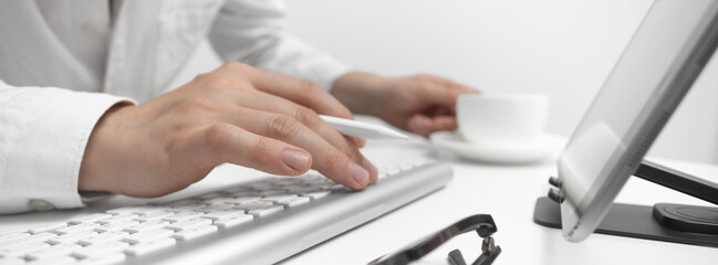 Businessman Working On Laptop In Bright Modern Office Concept