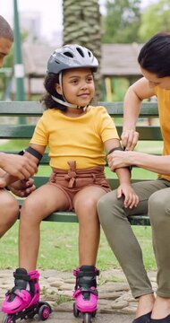 Roller skating, parents or girl in park with safety gear, childcare advice and support in summer hobby. Smile, help and family with elbow pads, parent guidance and connection for child development.