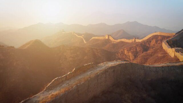 Aerial shot of the Great Wall of China at sunrise.