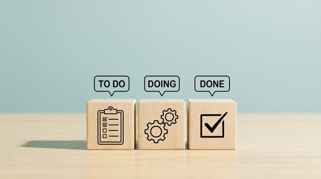 Project management wooden blocks with To Do, Doing, and Done icons. Task tracking workflow concept, agile methodology process, productivity and organization tools