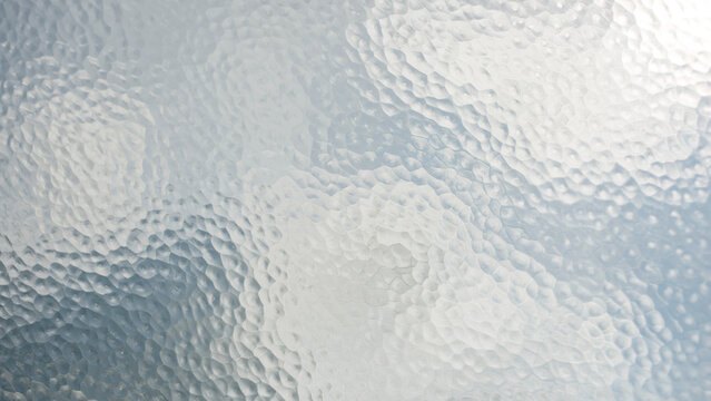 Abstract Frosted Textured Glass Background with Hammered Surface Pattern