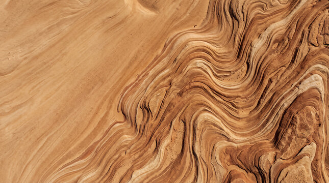 Top view of wavy sandstone texture background with natural patterns