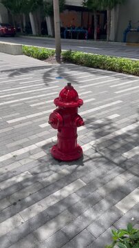 Red water hydrant for fire department connection. Emergency Water supply point features red fire hydrant installation among. Modern city infrastructure uses Emergency. Red Fire Hydrant.