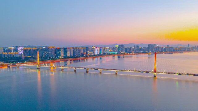 Nanchang Gan River cable-stayed bridge and skyline at sunset in Nanchang, Jiangxi, China
