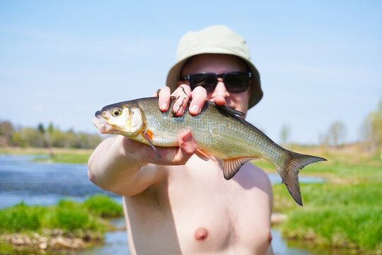 Close up of Fisherman Holding Vimba Fish by Venta River in Kuldīga Latvia