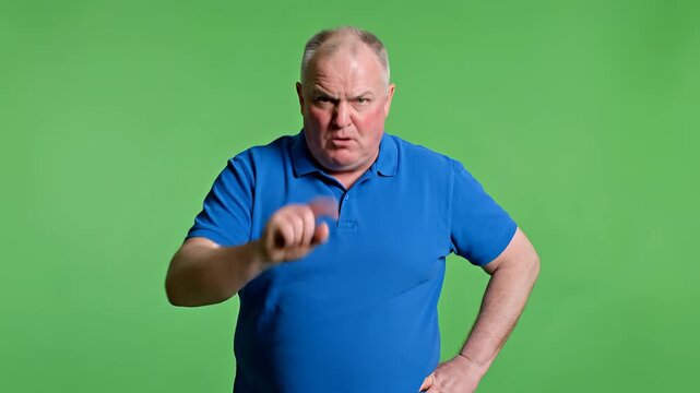 Angry Older Man Gesturing Stop and Warning on Green Screen.