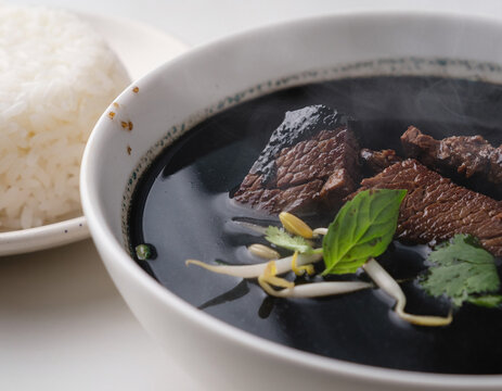 Indonesian Nasi Rawon Black Beef Soup with Rice Close-Up