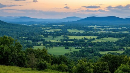 Fototapeta premium Panoramic mountain views at dusk showcasing stunning light contrasts and expansive valley vistas