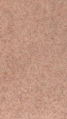 Fototapeta premium ​Reddish brown textured stucco wall surface close up