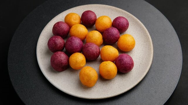 Thai deep fried sweet potato ball.Khanom khai nok kratha, is a traditional Thai dessert consisting of small deep-fried sweet potato balls, shaped to resemble quail eggs.