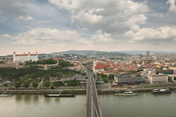 Obraz premium Aerial panoramic view of Bratislava cityscape with the castle, St. Martin's Cathedral, and Danube river