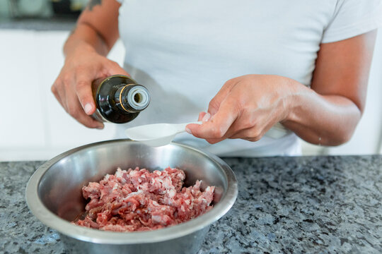 Preparing raw food BARF diet for healthy dogs