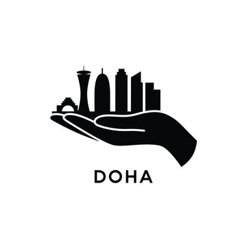 black silhouette icon of a hand holding doha city skyline