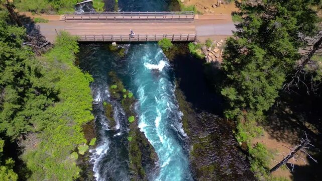 Drone view of the historic Wizard Falls Bridge crossing rapids in the Metolius river near Camp Sherman