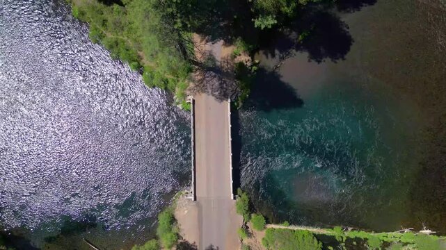 Drone view of the historic Bridge 99 crossing the crystal clear waters of the Metolius River near Camp Sherman in central Oregon