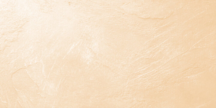 Pale beige textured background with subtle brush strokes and elegant plaster plasterboard effect for copy space. An elegant, soft beige-toned abstract textured background