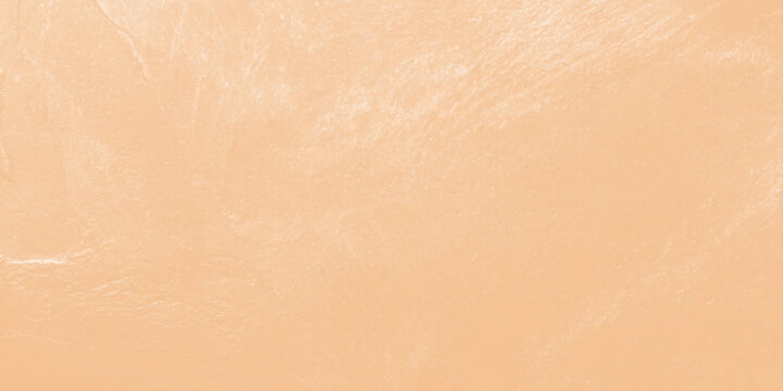 Pale beige textured background with subtle brush strokes and elegant plaster plasterboard effect for copy space. An elegant, soft beige-toned abstract textured background