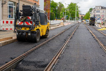 Fototapeta premium Rehabilitation of the city's rail network using asphalt and rollers