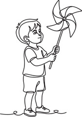 Fototapeta premium boy holding a pinwheel toy outdoors