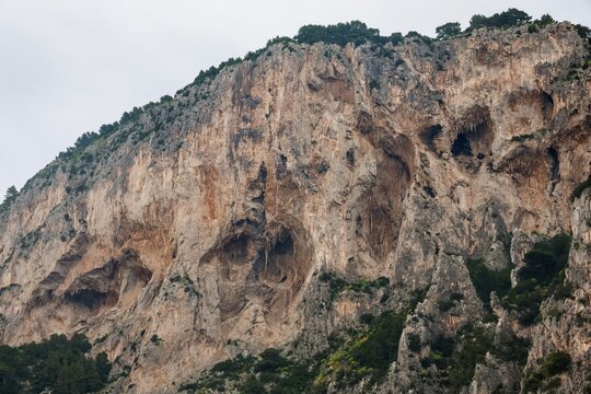 Capri island cliffs featuring natural caves and grottoes