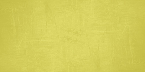 Fototapeta premium Yellow abstract textured concrete wall background with scratches and vintage grunge details for design layouts. subtle scratches, plaster textures, and a vintage grunge overlay