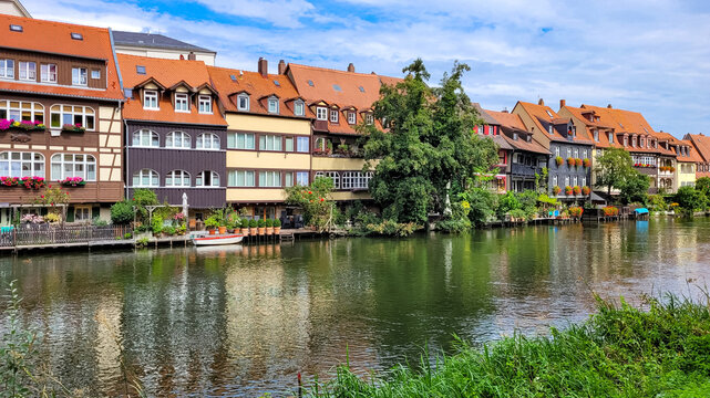 Little Venice with a row of old half-timbered fishermen's houses with red tiled roofs. Old historic fishing district near the river Regnitz in Bamberg, Germany.