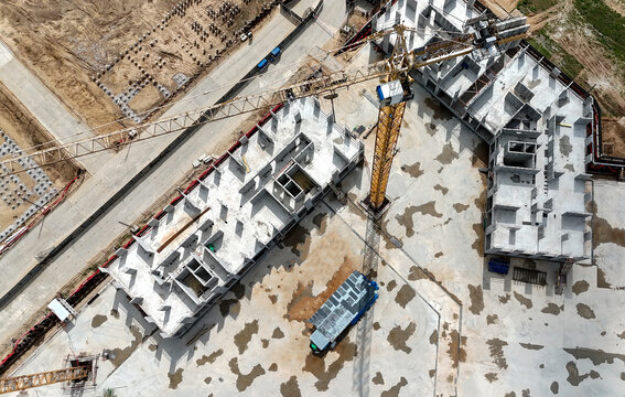 Aerial view of a construction site with unfinished buildings
