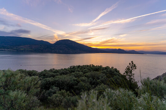 Penticton Okanagan Lake Sunset With Silt Cliffs And Kvr Trails, Scenic Canadian Landscape Views At Dusk