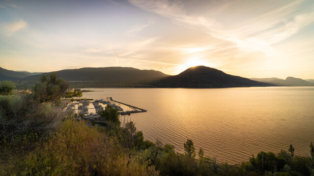 Penticton Okanagan Lake Sunset With Marina And Mountains, Scenic Canadian Landscape Views At Golden Hour